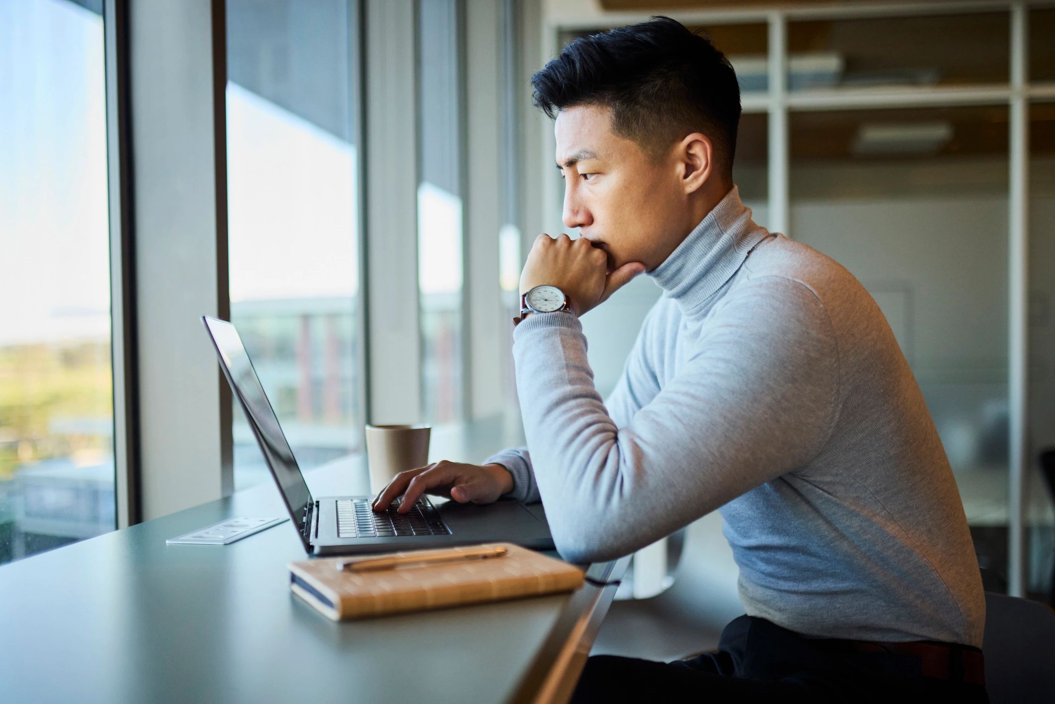 Portrait of a person working on a laptop