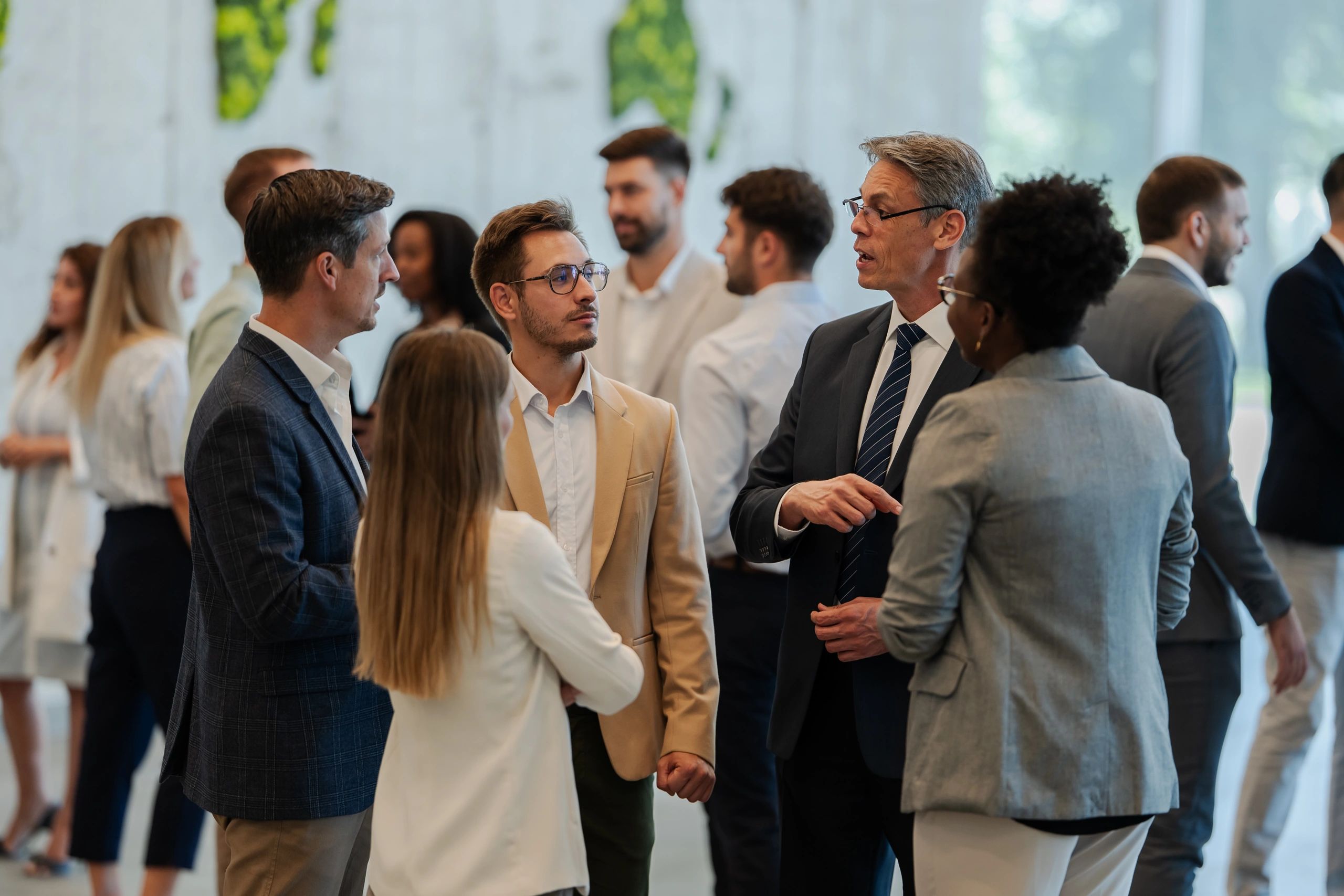 Professionals networking at a corporate conference